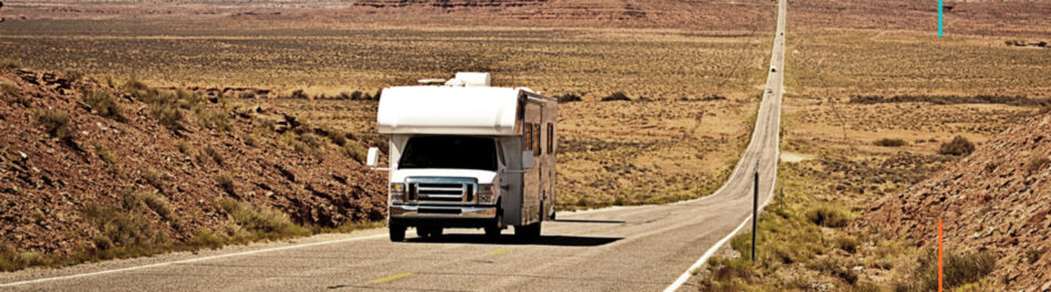 RV driving down long highway