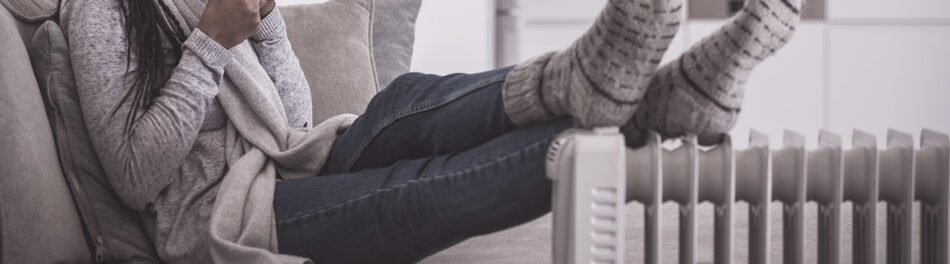 Feet resting on a space heater