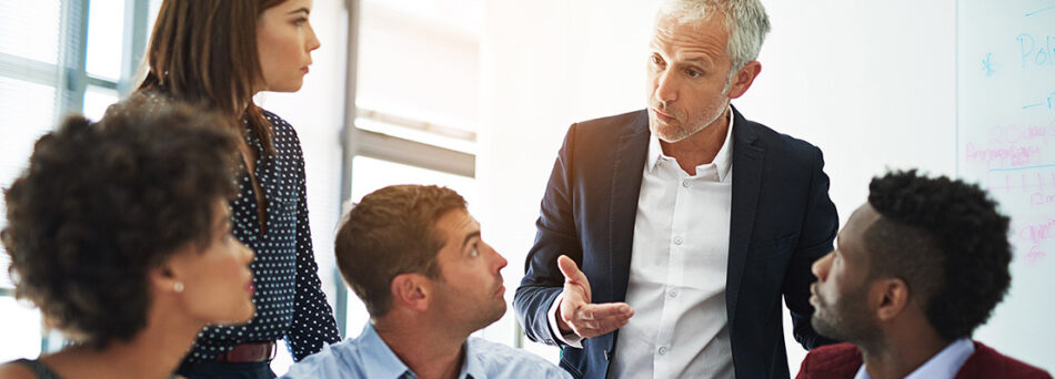 Group of business professionals talking in a meeting
