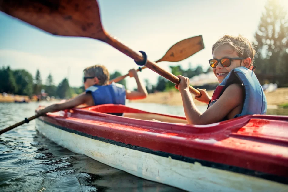Kids kayaking on lake