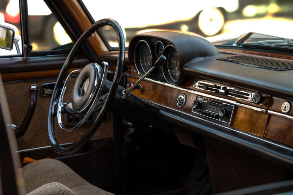 an old car dashboard with wood panelling