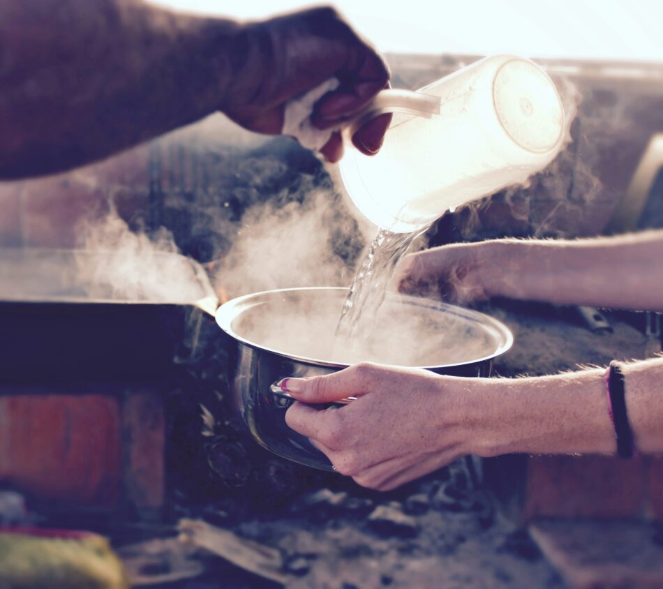 Boiling water in pot while camping