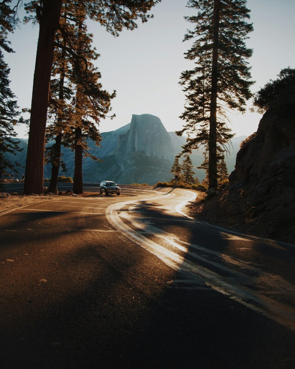 Vehicle driving on a windy road in a remote area