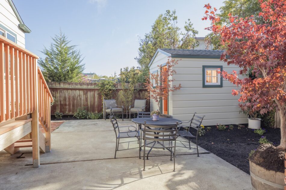 View of a backyard patio with a shed to the side