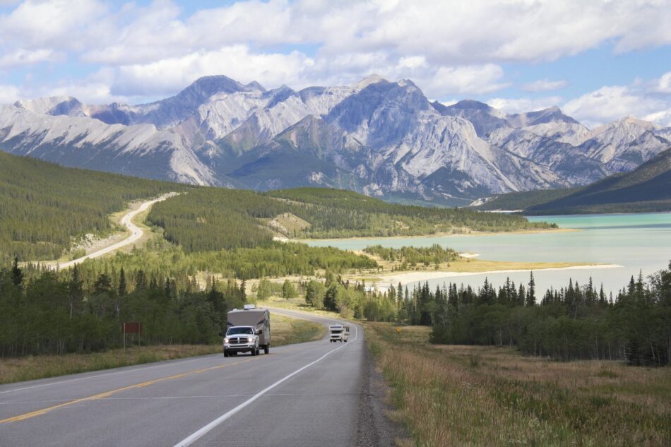 Road beside rocky mountains in Alberta