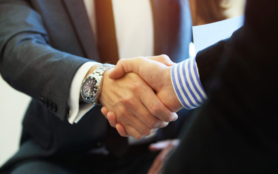 Business people shaking hands, finishing up a meeting