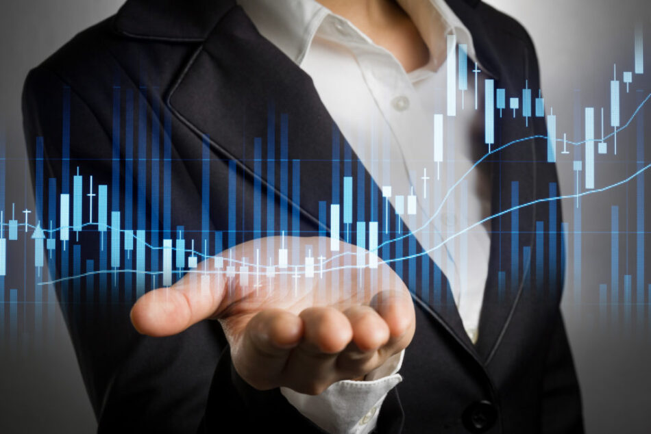 business woman in black suit open palm hand for show stock graph analyzed.