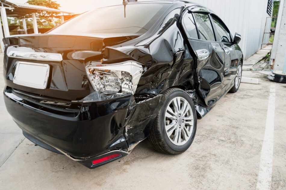 Rear view of a car with smashed bumper and backseat from a car accident