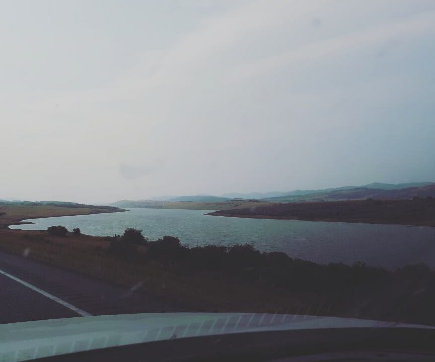 View of a large body of water on a foggy day