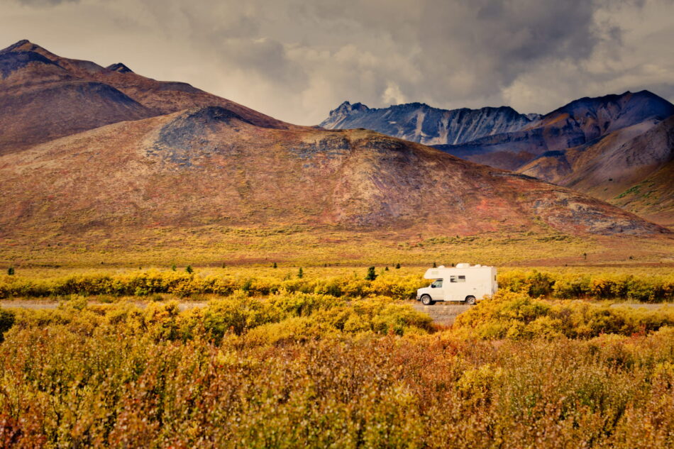 Dempster Highway Adventure, RV in fall color tundra landscape of Tombstone Territorial Park, Ogilvie Mountains, Yukon Territory, Canada