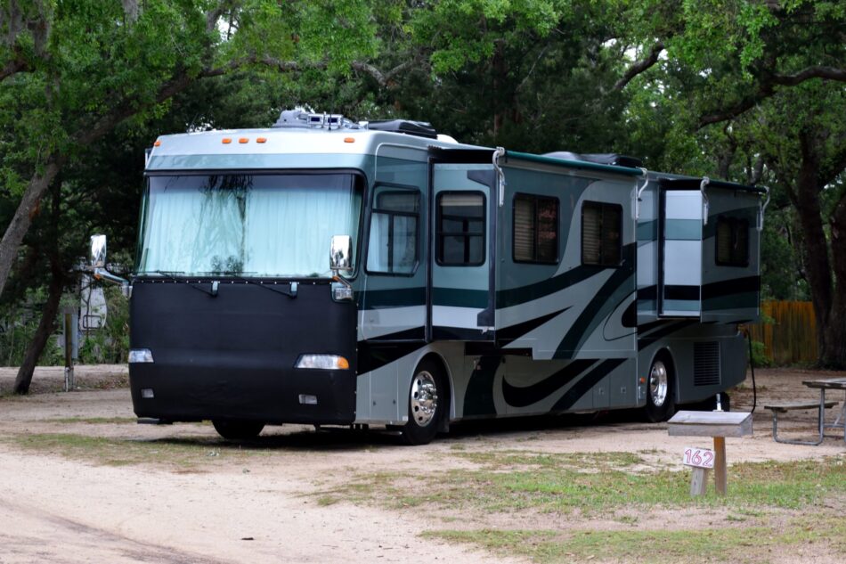 Large motorhome at campsite background