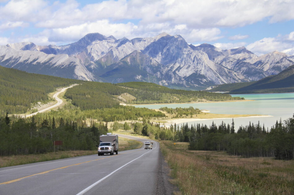 RV on a Winding Highway Next to a Mountain Lake in the Kootenay Plains - Alberta, Canada