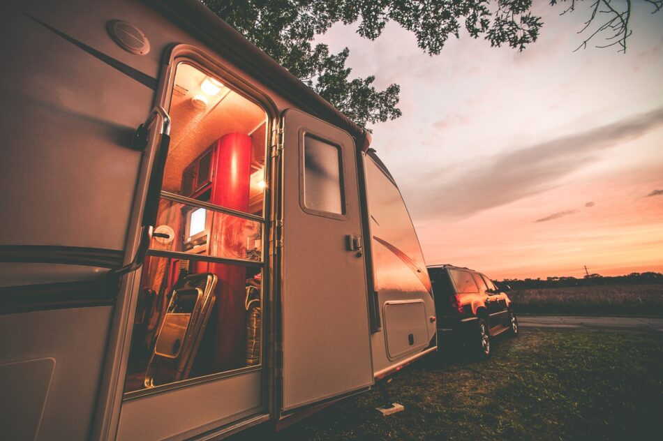 Parked trailer with open door at dusk