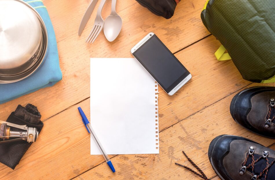 top down view of paper, pen, and a cellphone