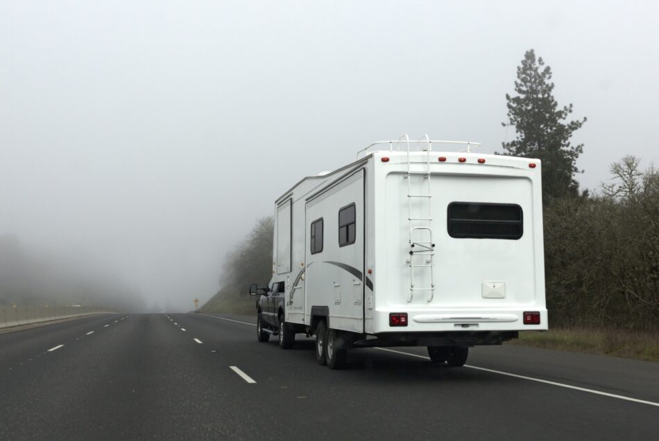 RV on foggy highway
