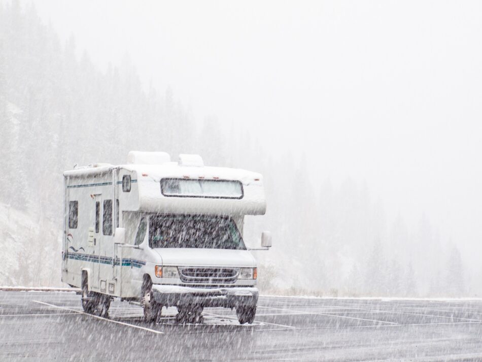 Motorhome parked in snowy parking lot
