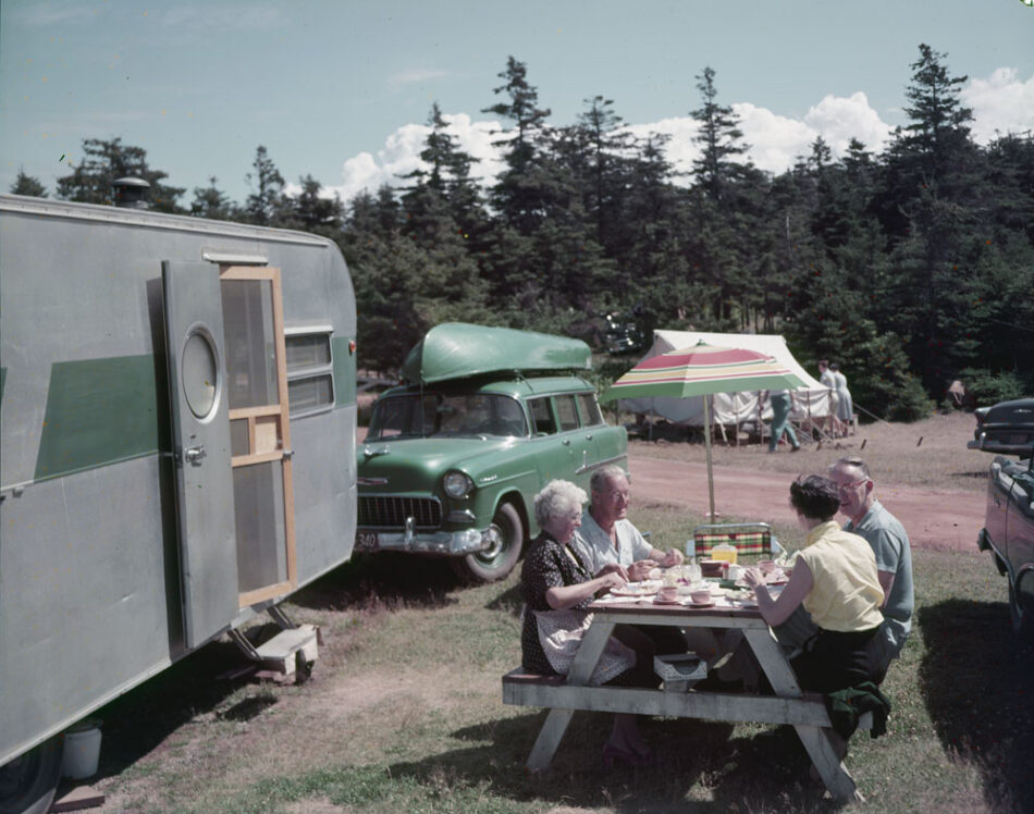 Vintage photo of people having a picnic in a campground