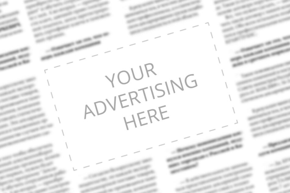 Close up of a copy space with written words Your Advertising Here on a blurred background of a newspaper. Business concept. Adding ad into paper page. Mockup of a newspaper advertisement column.