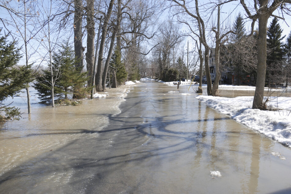 Street flood by a massive melting snow at spring.