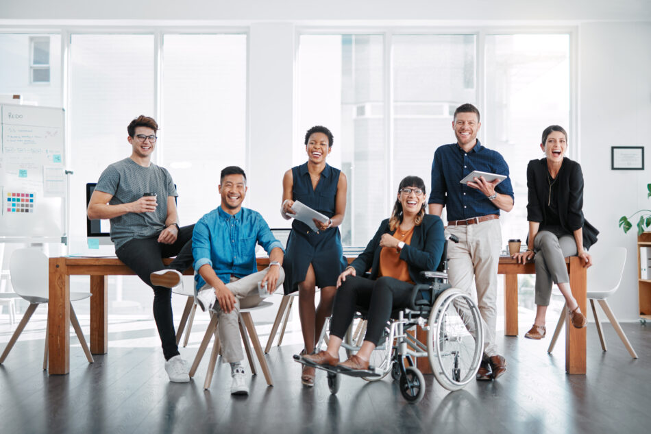 Portrait of a group of confident businesspeople working together in a modern office