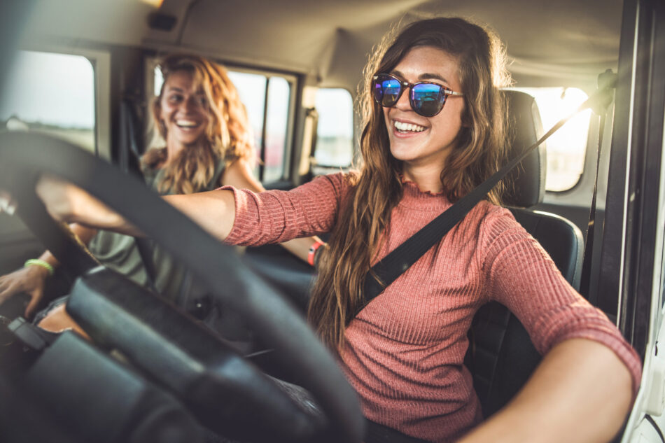 Two young women having fun on a roadtrip