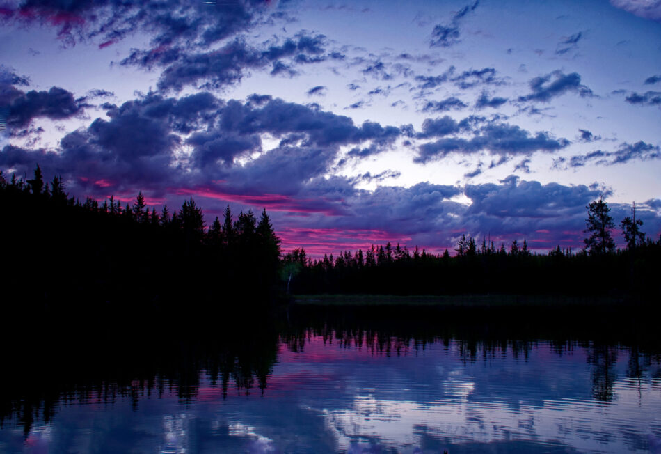 Lake and forest in northern Saskatchewan at sunset.