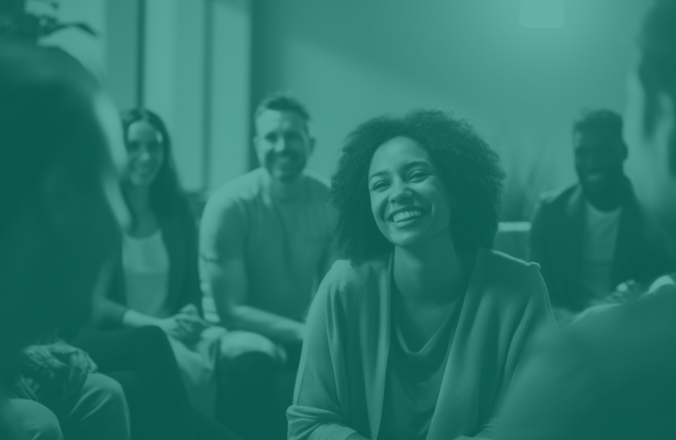 Group of people at work smiling at each other with a green overlay
