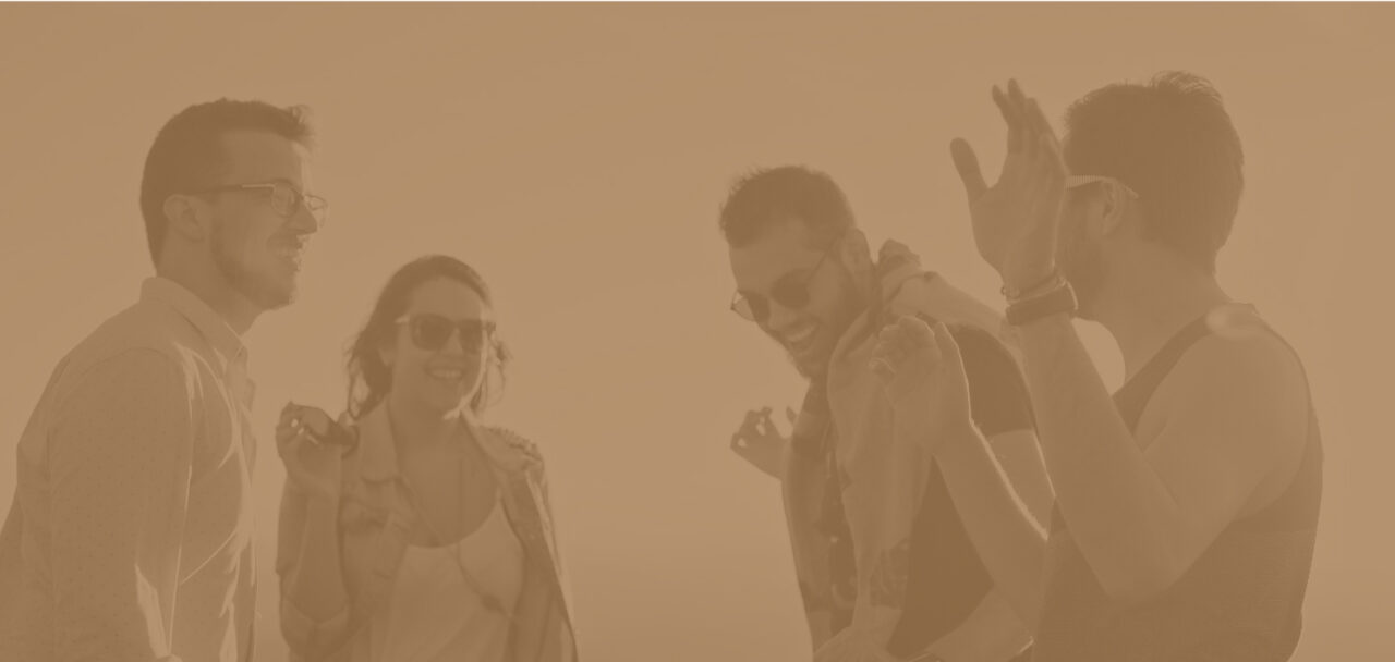 A group of friends dancing outdoors with a golden maple overlay