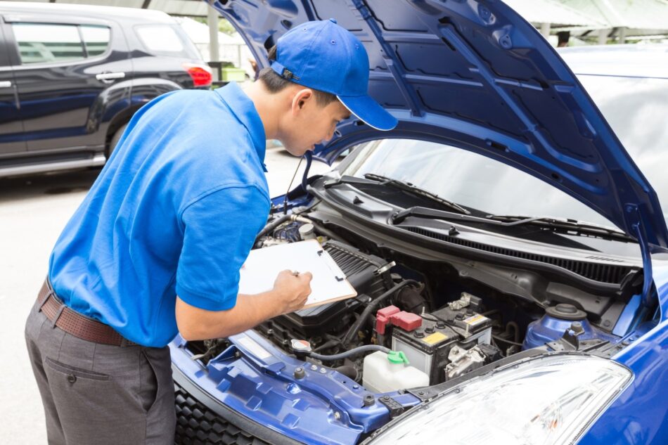 mechanic doing a vehicle safety inspection