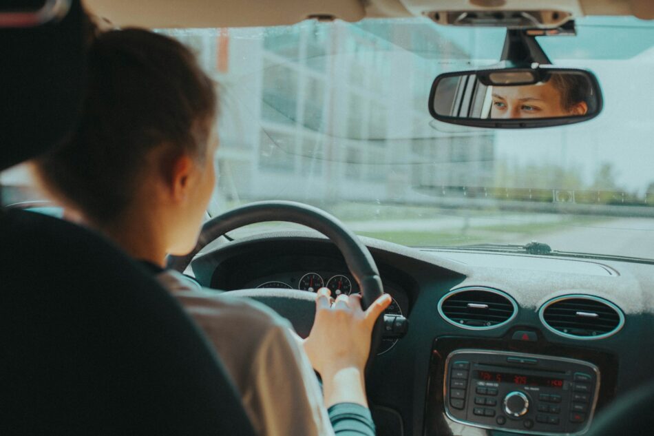 a woman driving a car in alberta