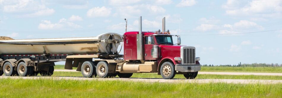 Large commercial vehicle driving on Canadian highway