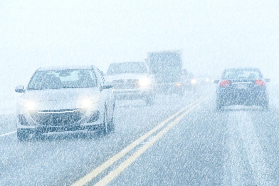 Cars driving on snowy highway