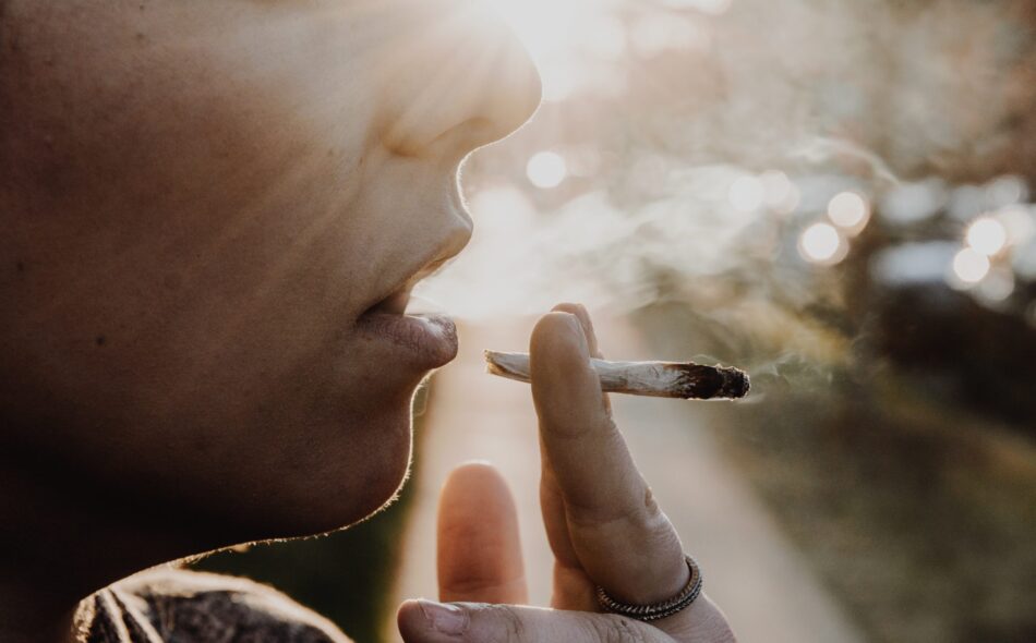 Closeup of a woman's mouth smoking
