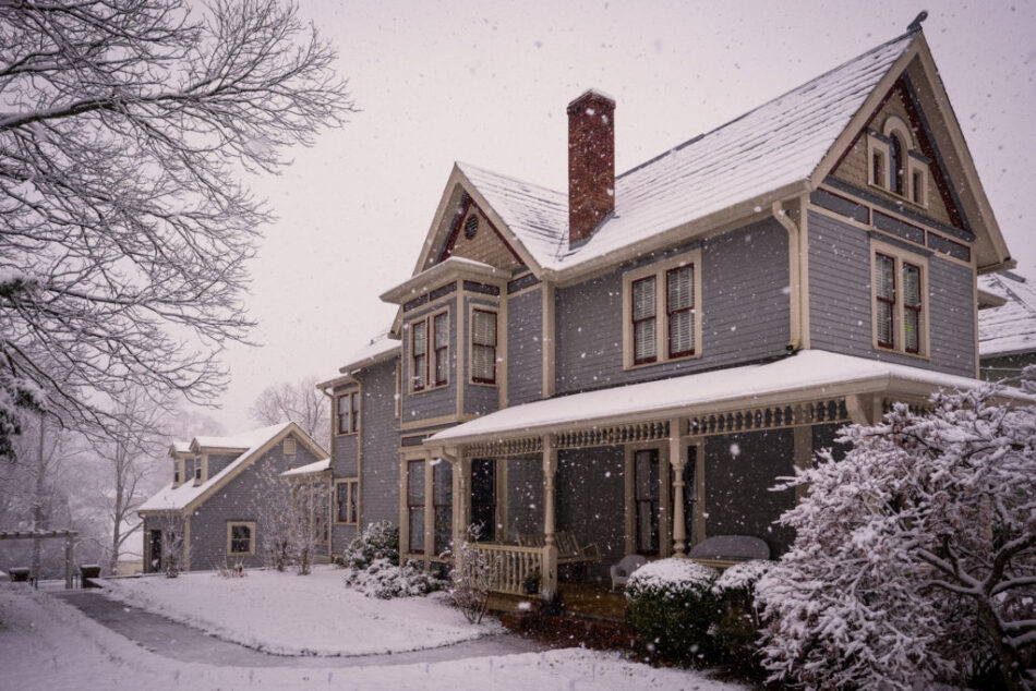 a victorian home after a snowstorm