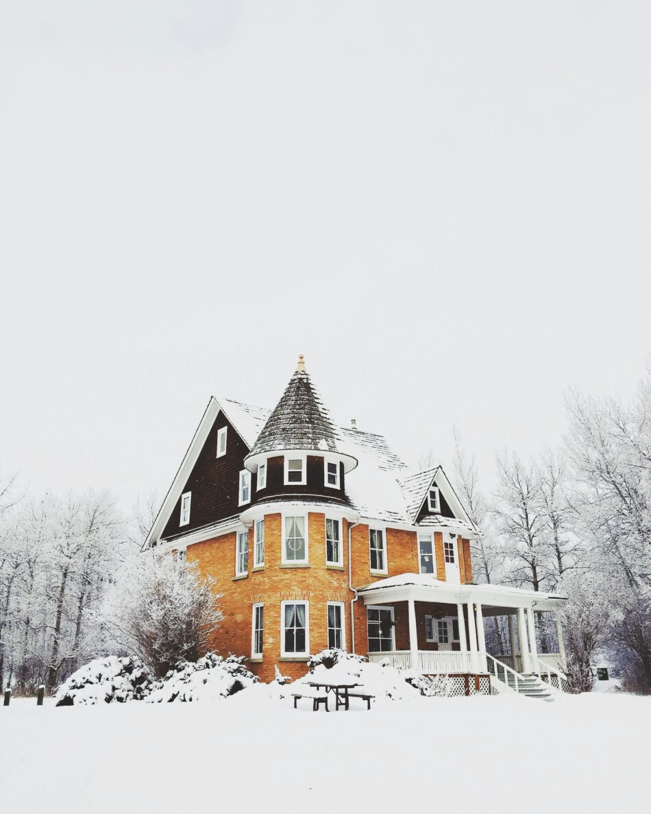 House with tall peaks in the winter covered in snow