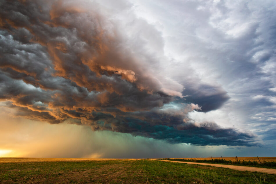 Dark storm clouds over a farm field
