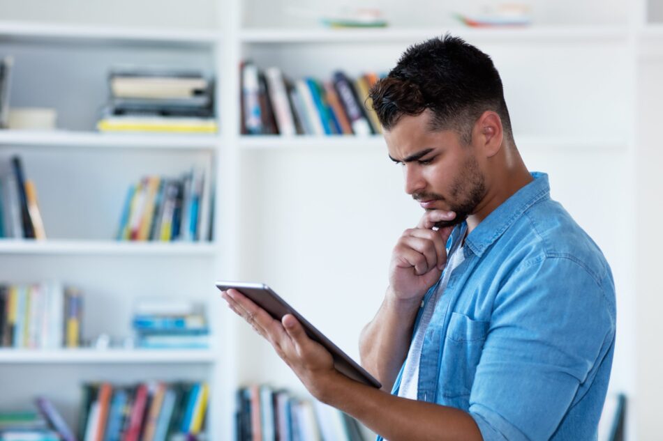 Man looking at online insurance quote on ipad