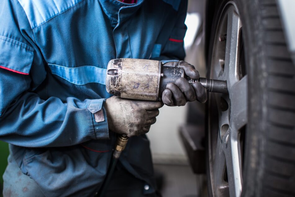 Mechanic removing winter tires