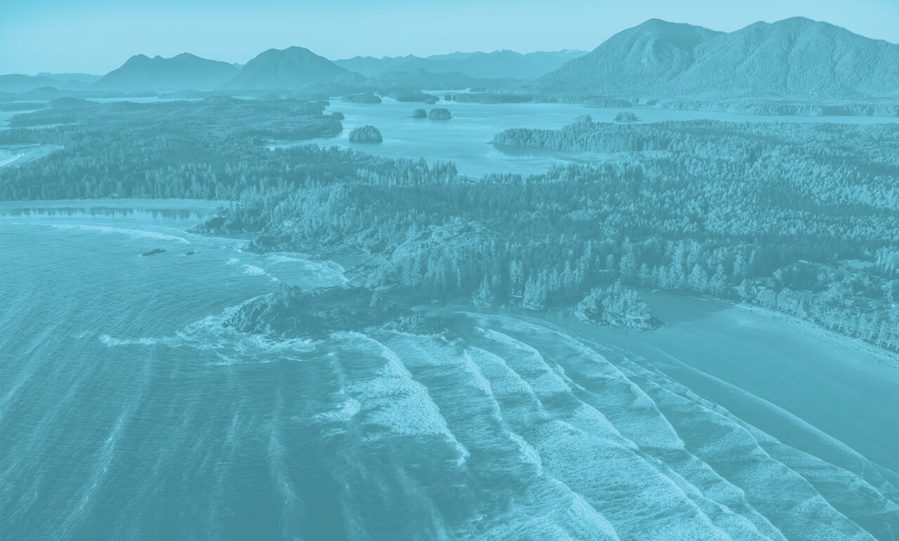 Aerial view of tofino coast and wavy ocean, with a sky blue overlay