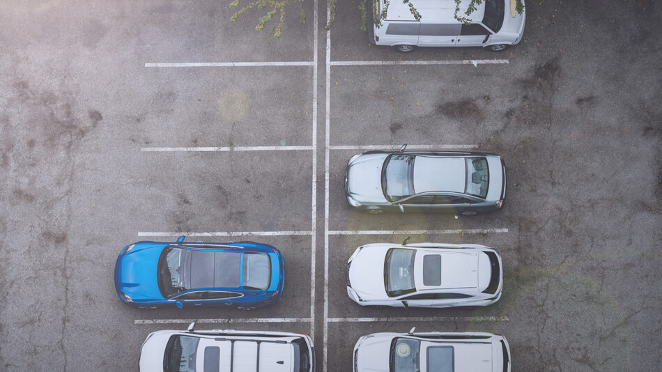 Aerial view of a half-full parking lot