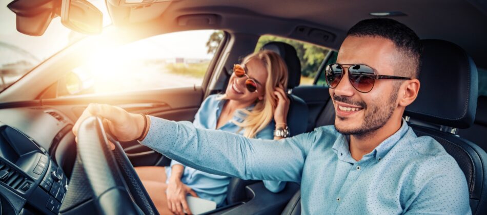 Couple in leased vehicle smiling