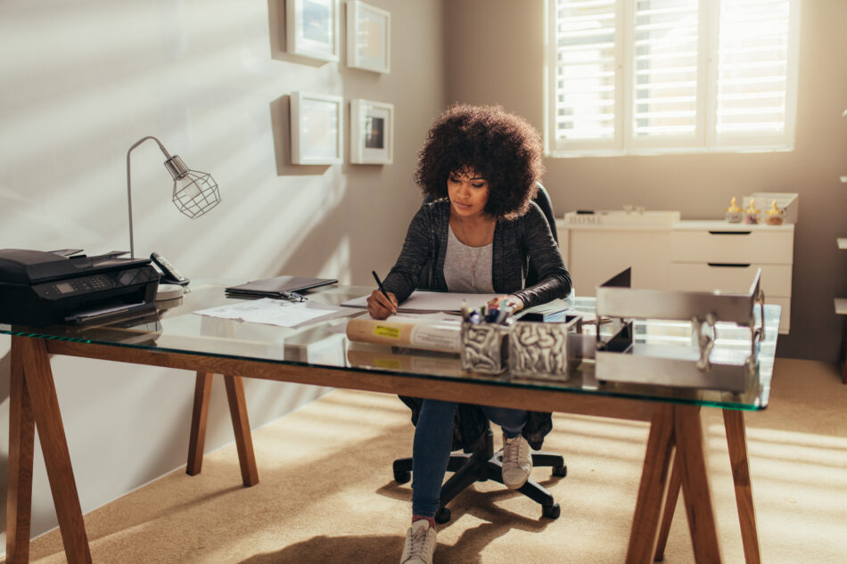 Woman sitting at desk of her home-based business