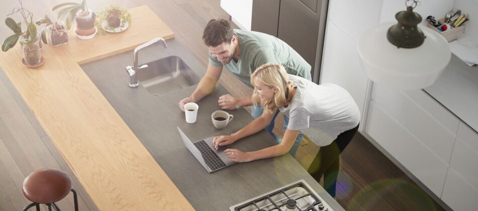 Couple in a condo kitchen having coffee