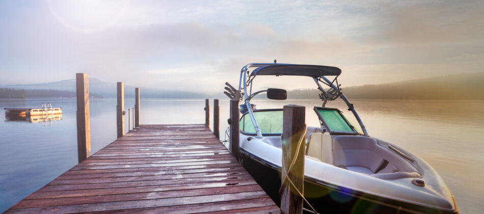 Boat tethered on wooden dock
