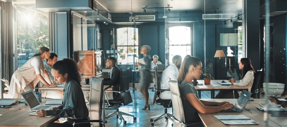 View of the inside of a busy modern open-concept office building