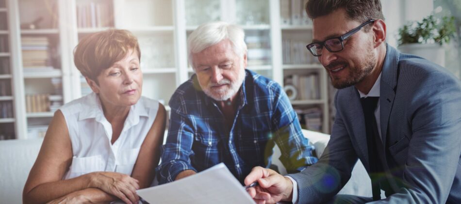 a middle-aged couple working with a financial advisor on their estate planning and avoiding probate