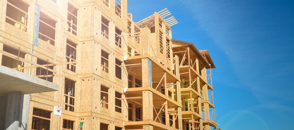 Exterior of a wood building mid-construction