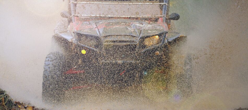 ATV driving through dirt