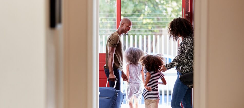Young family at the front door of a vacant home
