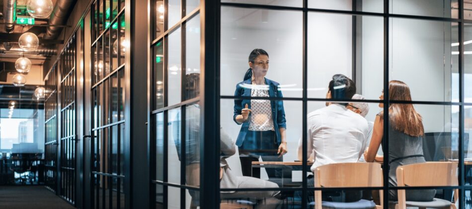 Business in modern glass office